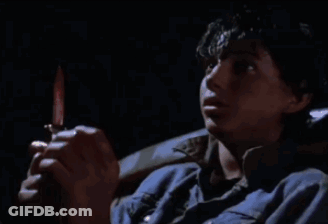 Man In Blue Shirt Holding Knife GIF