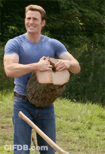 Man In Blue Shirt Holding Log And Shovel GIF