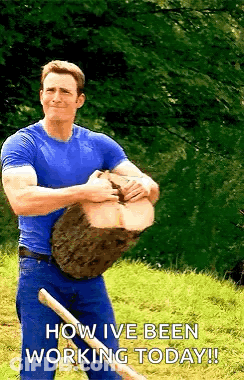 Man In Blue Shirt Holding Log With Shovel GIF