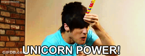 Man In Blue Shirt Holding Lollipop Forehead Unicorn Power GIF