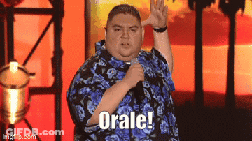 Man In Blue Shirt Holding Microphone Saying Orale GIF