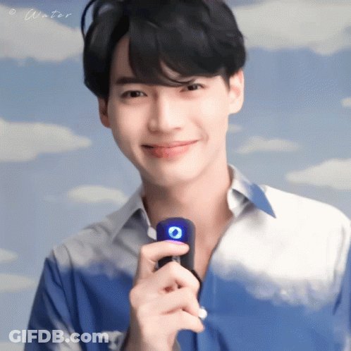 Man In Blue Shirt Holding Microphone Saying Water GIF