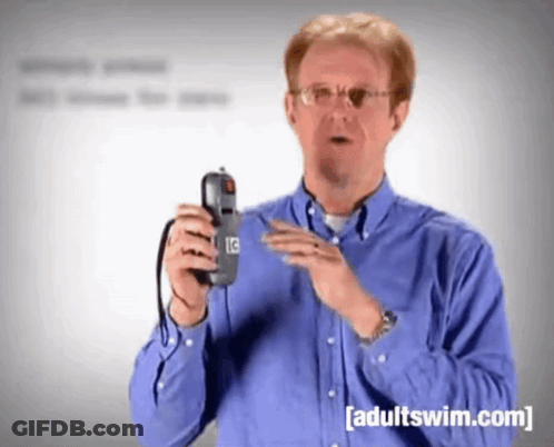 Man In Blue Shirt Holding Phone Adult Swim.com GIF