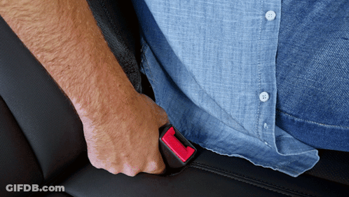 Man In Blue Shirt Holding Seat Belt GIF