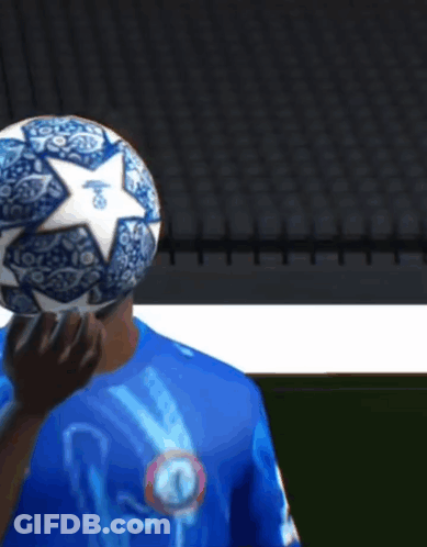 Man In Blue Shirt Holding Skull Soccer Ball GIF
