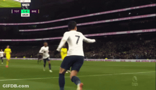 Man In Blue Shirt Holding Soccer Ball With Skull GIF