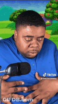 Man In Blue Shirt Holding Stomach GIF