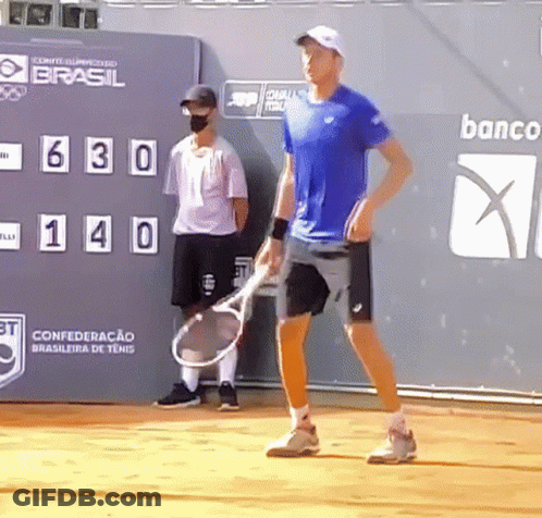 Man In Blue Shirt Holding Tennis Racquet GIF