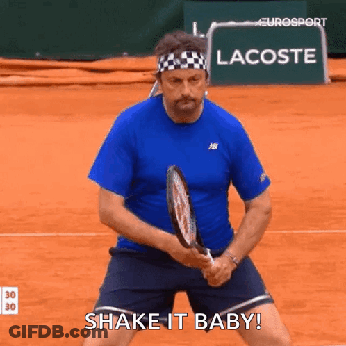 Man In Blue Shirt Holding Tennis Racquet GIF