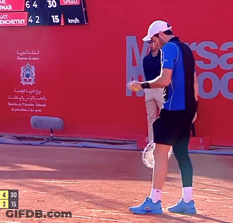 Man In Blue Shirt Holding Tennis Racquet GIF