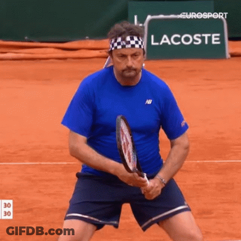 Man In Blue Shirt Holding Tennis Racquet With Lacoste GIF