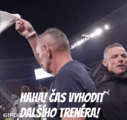 Man In Blue Shirt Holding White Flag Saying Haha Cas Vyhodit Dalsiho Trenera GIF