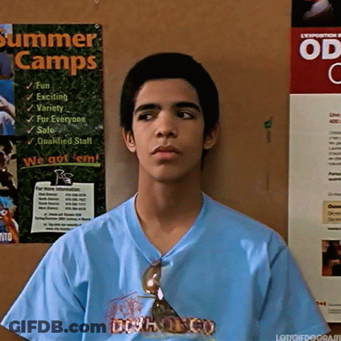 Man In Blue Shirt Holding Wood GIF
