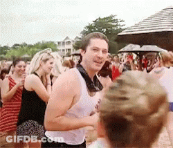 Man In Blue Shirt Hugging Woman In Green Dress GIF