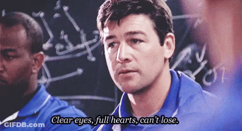 Man In Blue Shirt In Front Of Blackboard GIF