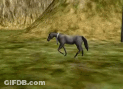 Man In Blue Shirt In Front Of Cannon GIF