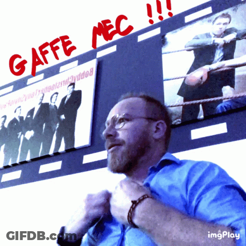 Man In Blue Shirt In Front Of Gaffe Mec Sign GIF