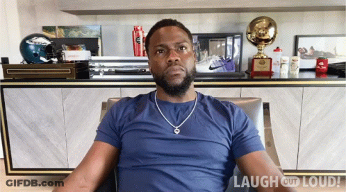 Man In Blue Shirt In Front Of Laugh Out Loud Logo GIF
