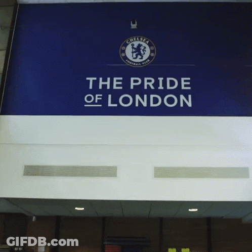 Man In Blue Shirt In Front Of Pride Of London Sign GIF