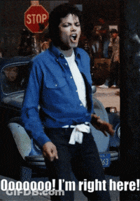 Man In Blue Shirt In Front Of Red Stop Sign GIF