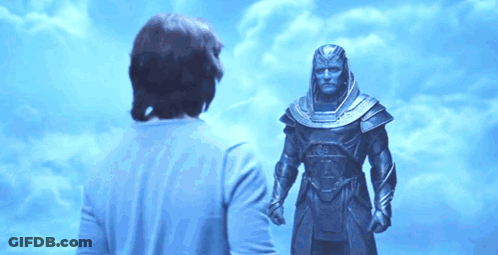 Man In Blue Shirt In Front Of Statue GIF