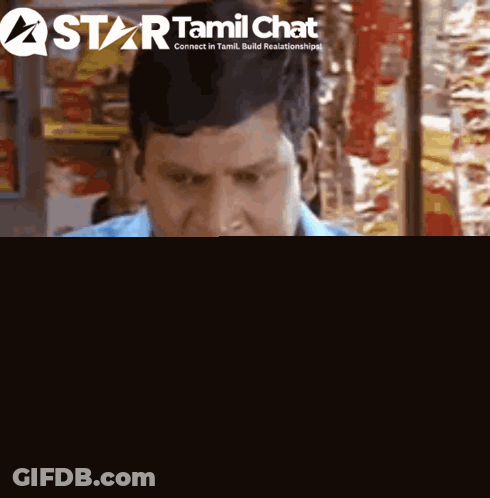 Man In Blue Shirt In Front Of Tamil Chat Logo GIF