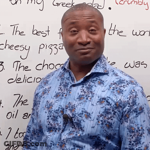 Man In Blue Shirt In Front Of Whiteboard Saying Best F Cheesy Pizza GIF
