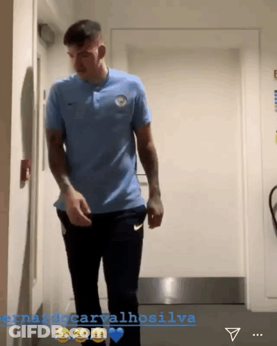 Man In Blue Shirt In Hallway Fernando Carvalhosilva GIF