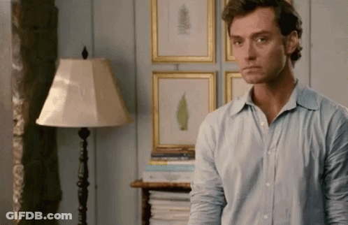 Man In Blue Shirt In Living Room GIF