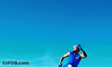 Man In Blue Shirt Jumping In The Air GIF