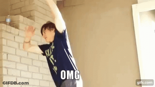 Man In Blue Shirt Jumping Over Brick Wall Omg GIF