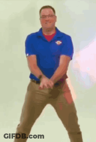 Man In Blue Shirt Khaki Pants Arms Outstretched GIF