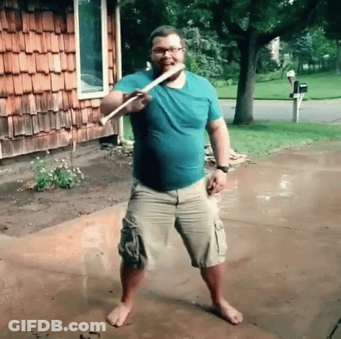 Man In Blue Shirt Khaki Shorts With Stick GIF