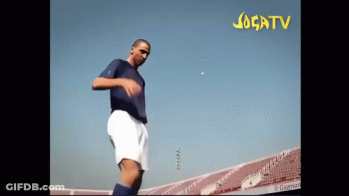 Man In Blue Shirt Kicking Soccer Ball Jogatv GIF
