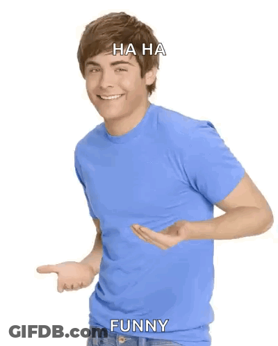 Man In Blue Shirt Laughing And Pointing Saying Ha Ha Funny GIF