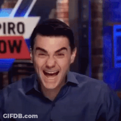 Man In Blue Shirt Laughing In Front Of Piro Now Sign GIF