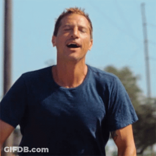 Man In Blue Shirt Laughing With Mouth Open GIF