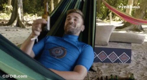 Man In Blue Shirt Laying In Hammock GIF