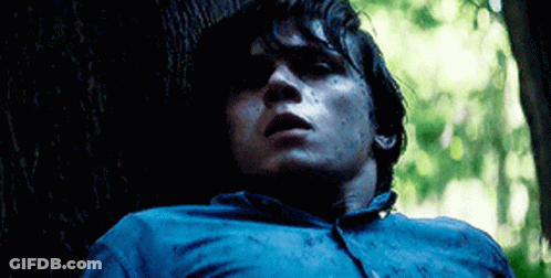Man In Blue Shirt Leaning Against Tree GIF