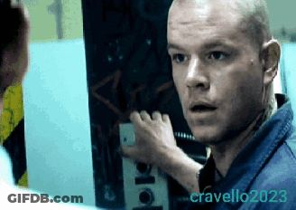 Man In Blue Shirt Looking At Photo By Cravello GIF