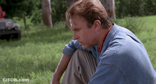 Man In Blue Shirt Looking Down GIF