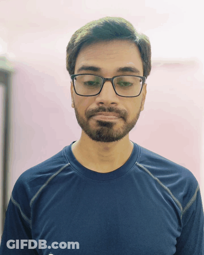 Man In Blue Shirt Looking Down GIF