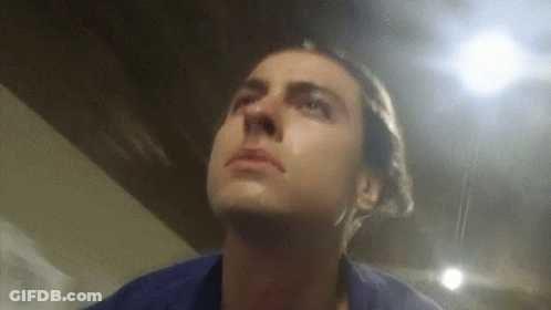 Man In Blue Shirt Looking Up GIF