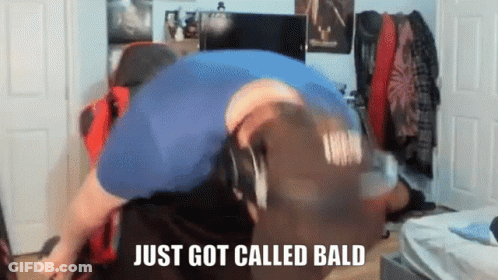 Man In Blue Shirt Lying Down Bald Call GIF