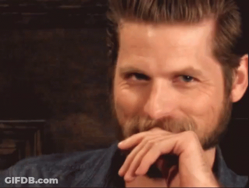 Man In Blue Shirt Lying On Couch GIF