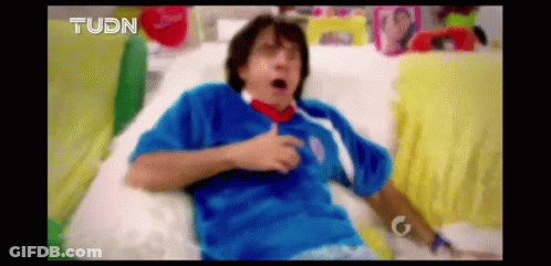 Man In Blue Shirt Lying On Couch GIF