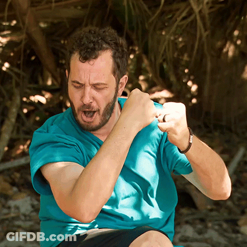 Man In Blue Shirt Making A Fist GIF