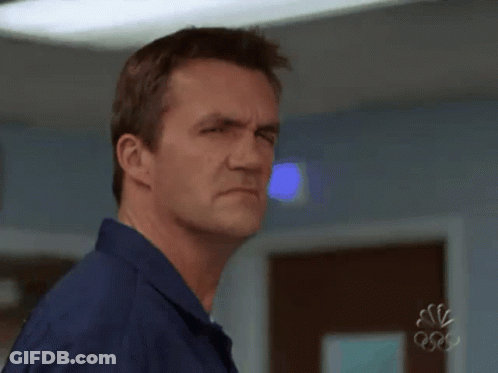 Man In Blue Shirt Making Face At Olympics GIF