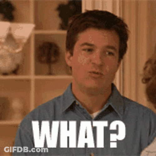 Man In Blue Shirt Making Face Saying What GIF