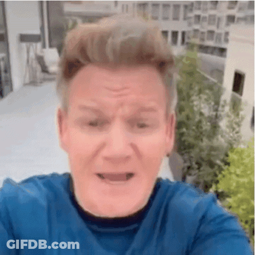 Man In Blue Shirt Making Face With Mouth Open GIF